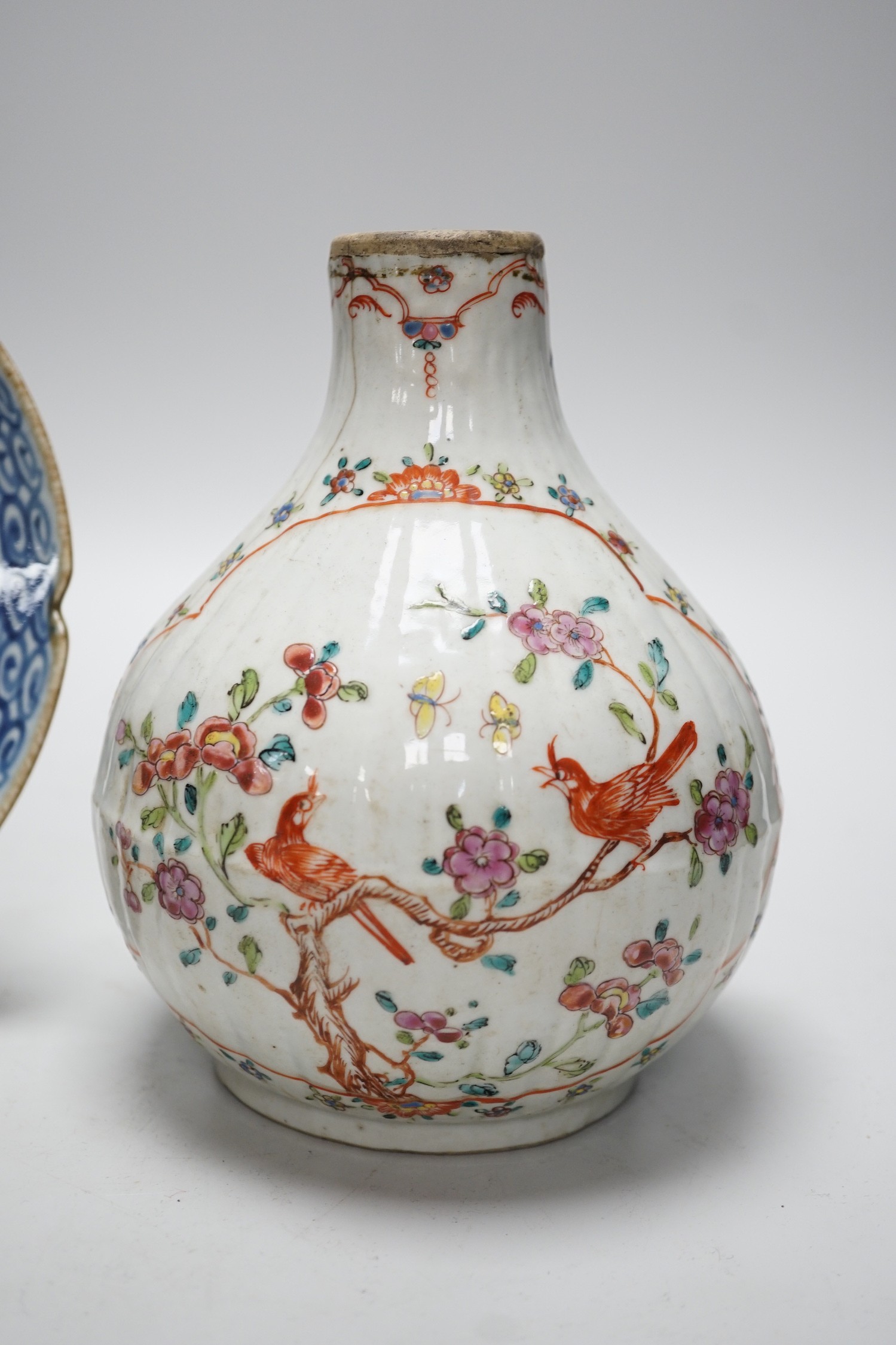 A Chinese Kangxi period clobbered bottle vase, reduced, height 29.5cm, and a Chinese plate, vase 18cms high